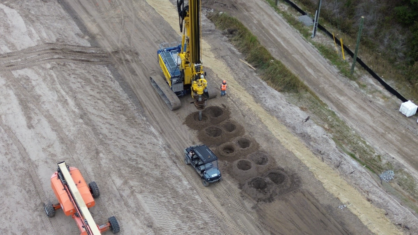 Predrilling ahead of cut off wall installation